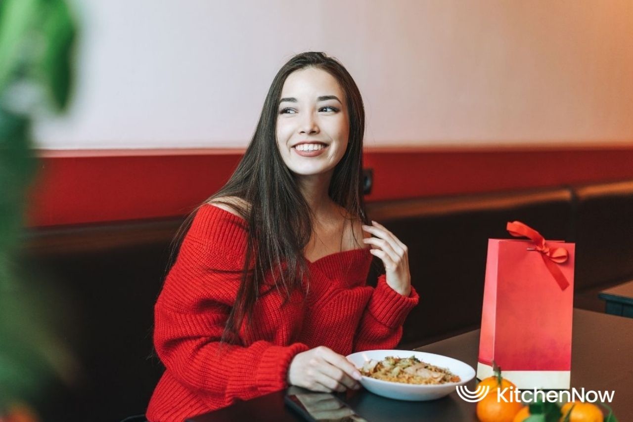 happy-girl-enjoying-chinese-food-in-restaurant