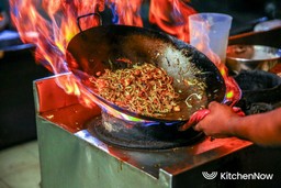 chef-cooking-asian-food-with-wok-fire